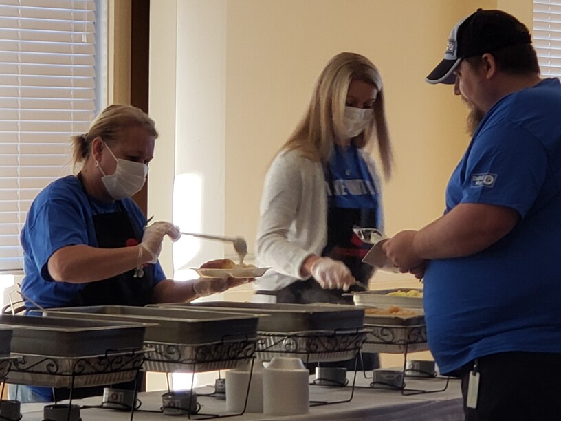 Longwood University Volunteers and UW Staff serving volunteers breakfast